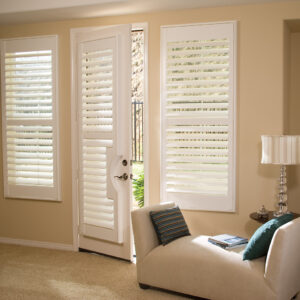 Premium painted wood plantation shutters in white finish installed on living room window