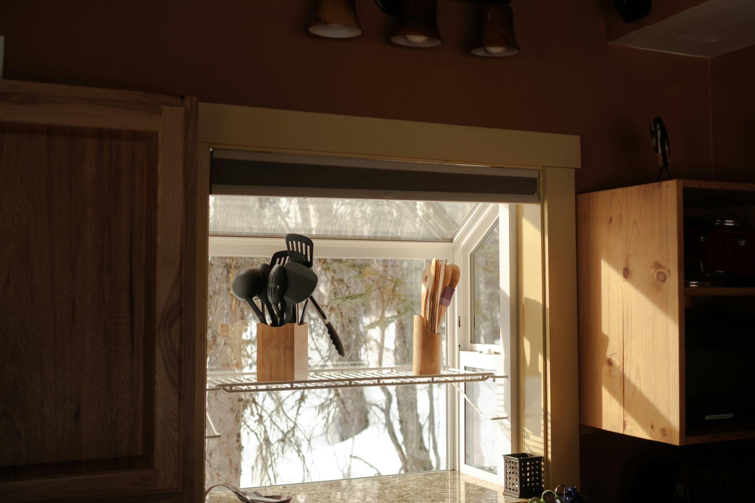 Roller shades installed in kitchen