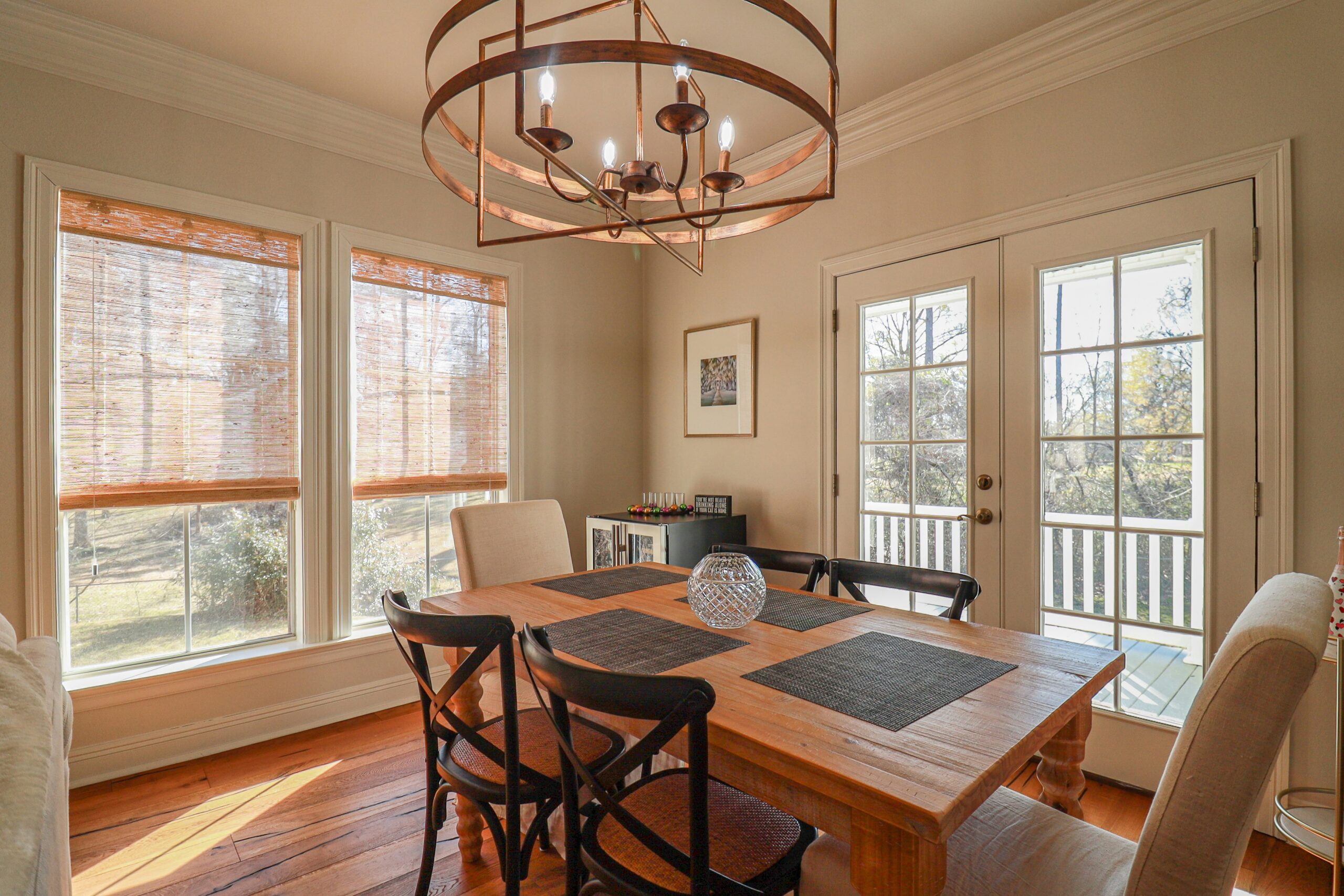 Dining Room installed premium wood blinds offered by Buy Home Blinds